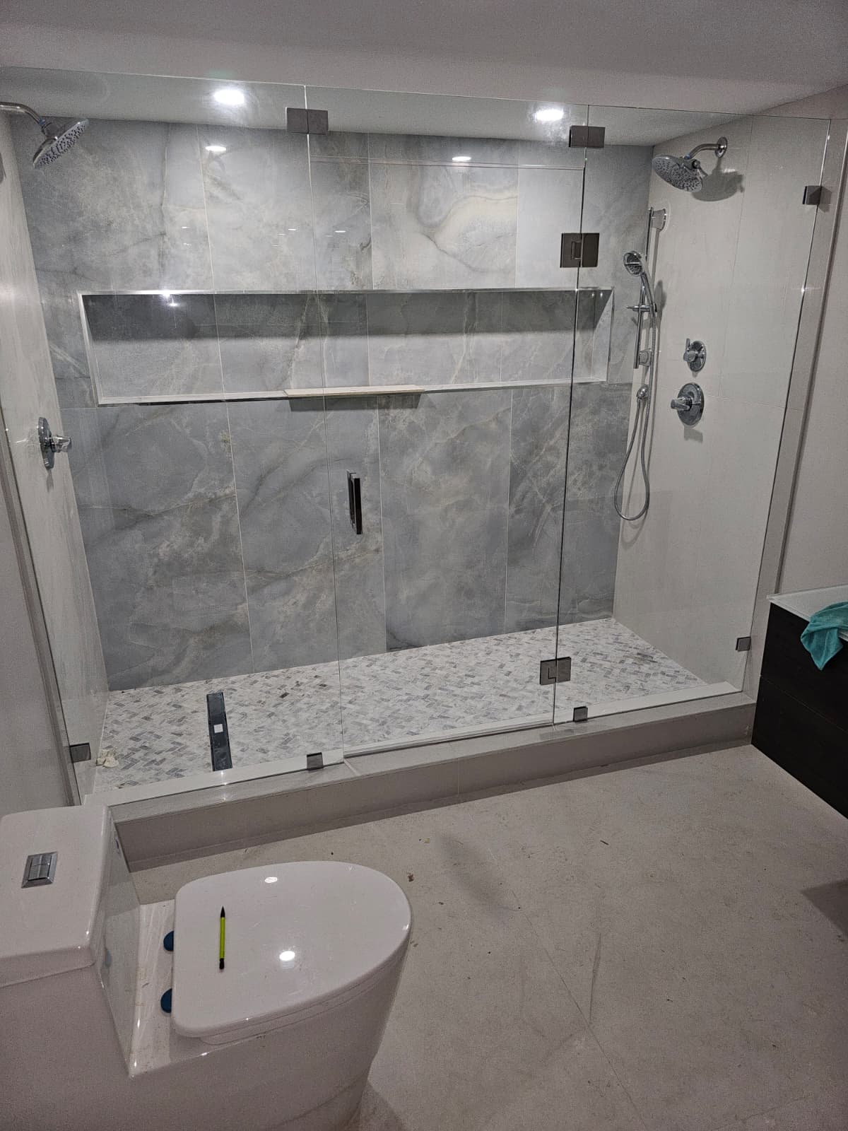 Custom gray stone shower renovation